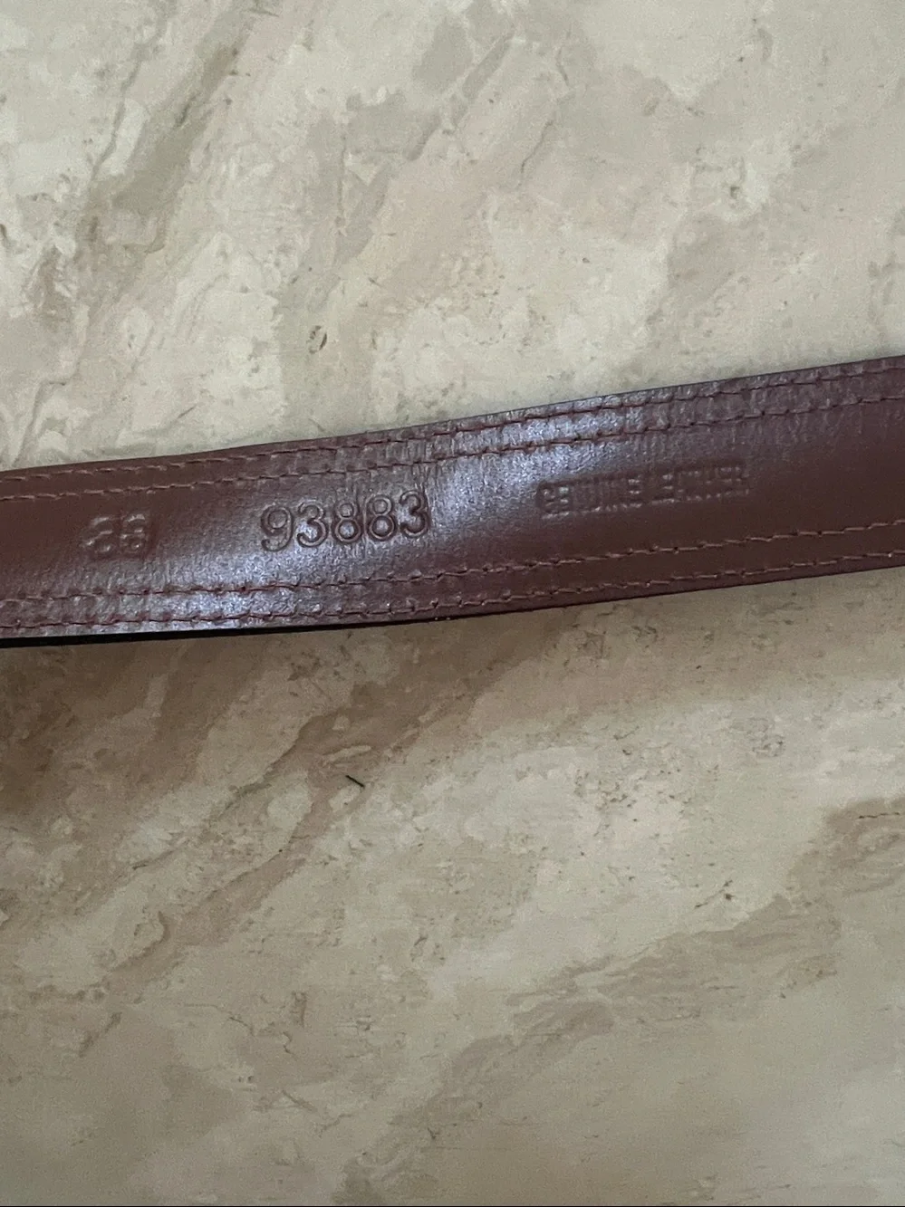 Nautica men's belt featuring brown leather,blue canvas inlay, brass buckle